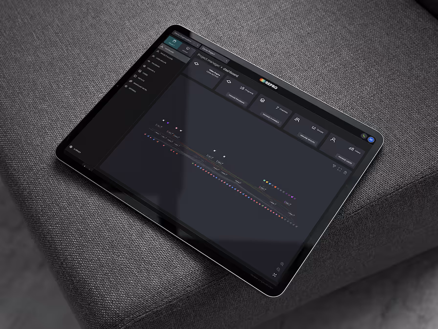 A black tablet with a screen displaying a menu.