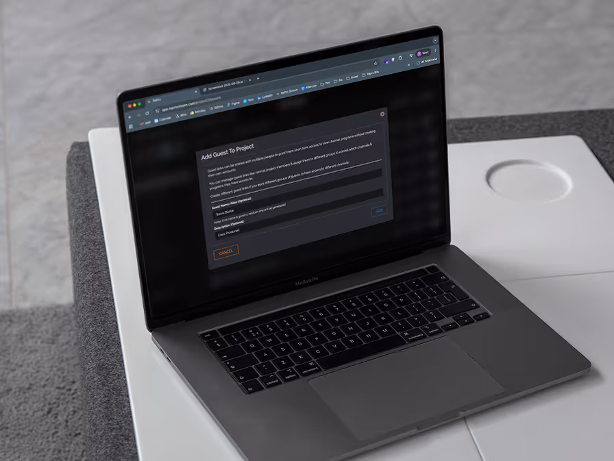 A black laptop with a screen that says "Add Guest User".