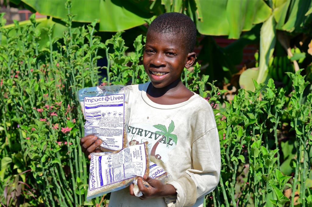 1 Boy with IMPACT LIVES food
