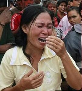 A person crying in front of a crowdAI-generated content may be incorrect.