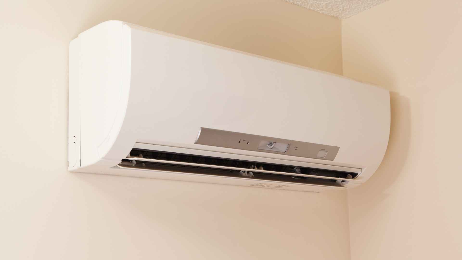 Ductless mini-split air conditioning unit mounted on a wall, illustrating energy-efficient home cooling solutions.