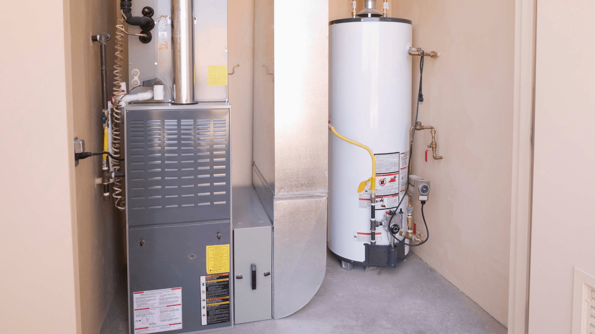 Heating system installation featuring a furnace and water heater, relevant to HVAC services and troubleshooting for lukewarm air issues.