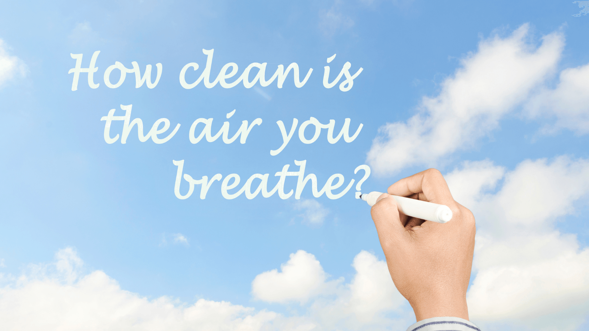 Hand writing "How clean is the air you breathe?" against a blue sky with clouds, emphasizing air quality and health concerns.