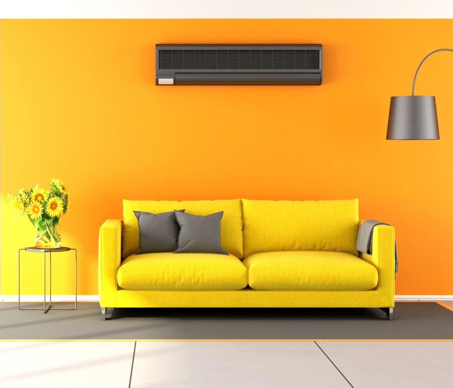 Yellow sofa with gray pillows and a decorative vase of sunflowers, featuring a wall-mounted air conditioning unit above in a vibrant orange room, reflecting a comfortable home environment for HVAC system installation considerations.