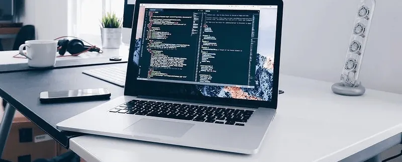 Laptop displaying programming code









