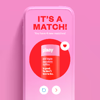 Mobile screen showing a pink match notification with a chocolate truffle product and a heart icon.