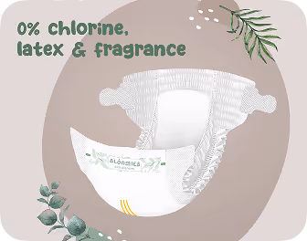 Open diaper with text stating 0% chlorine, latex & fragrance, decorated with green leaves and beige background.