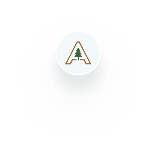 Smiling young woman with glasses, wearing a black blazer and white shirt, looking at the camera.