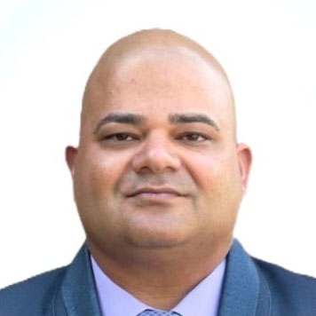 A headshot photo of Andy Sharma