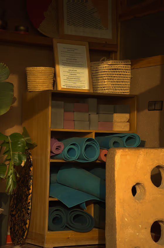 Yoga mats and woven baskets storage area at Salt House Morocco