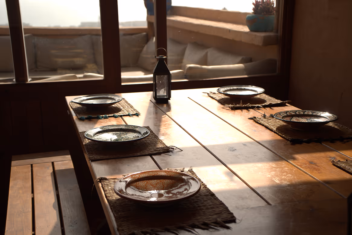 Outdoor dining table setup on the terrace at Salt House Morocco in Tamraght