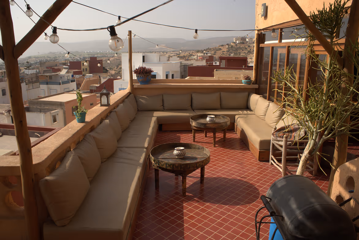 Rooftop terrace at Salt House Morocco in Tamraght with cozy Moroccan seating and ocean view