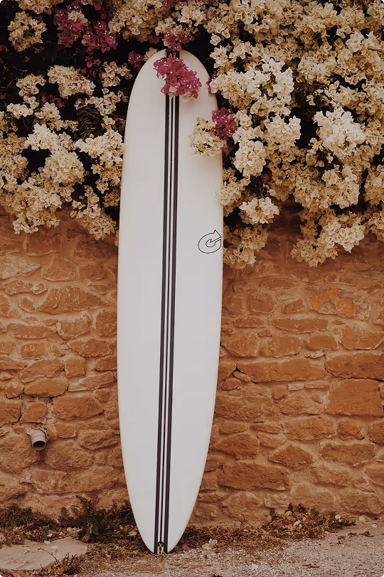 Minimalist longboard surfboard with clean white finish