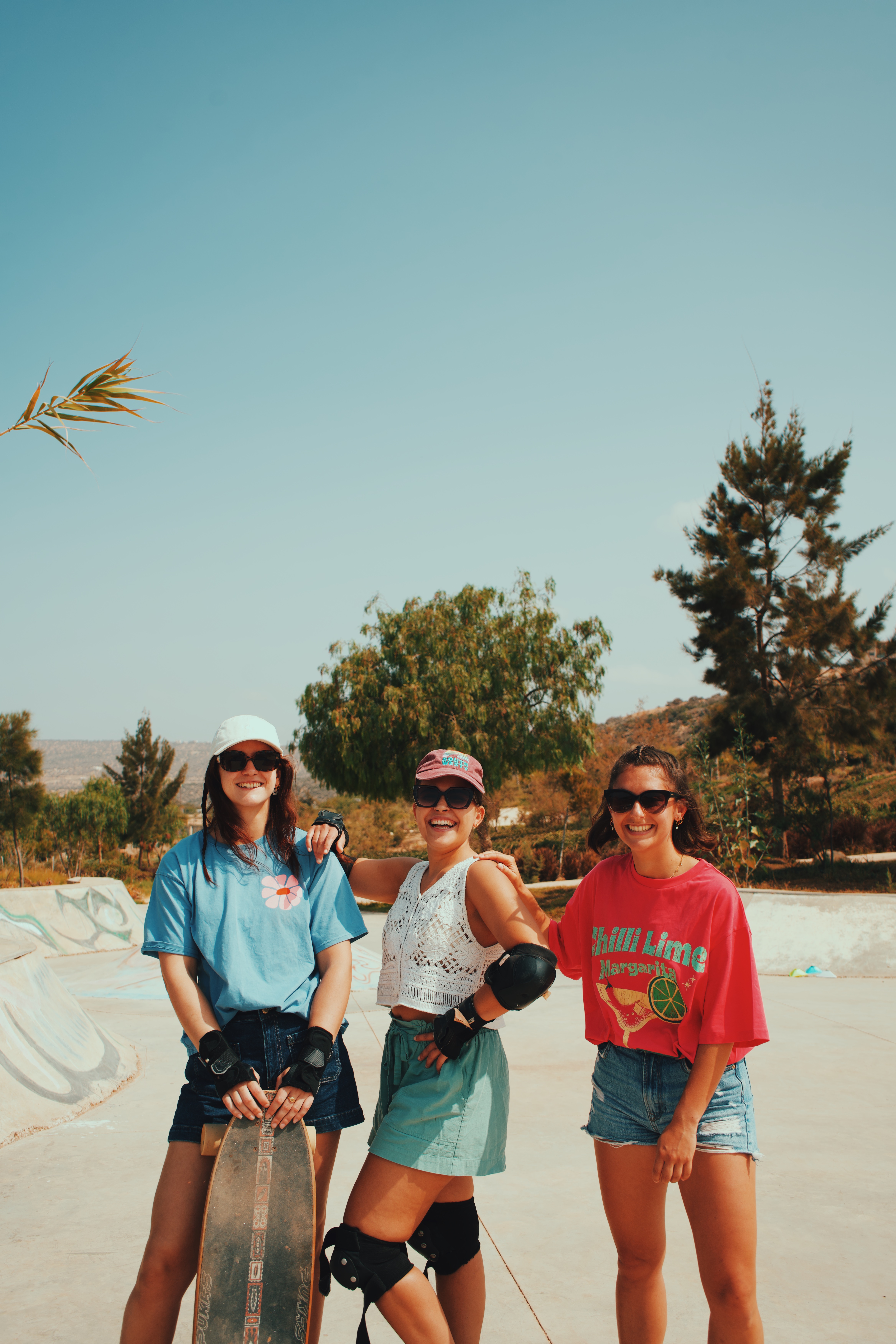 Three Salt House guests laughing together outside the camp in Tamraght