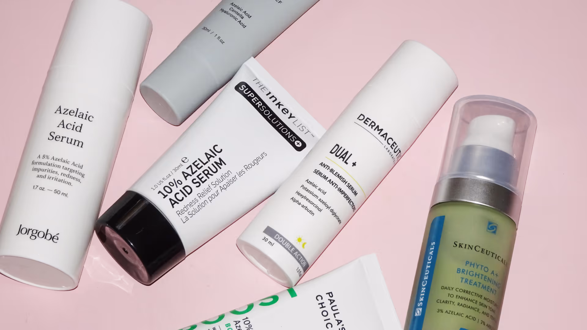 Test av azelainsyra från Common Clouds, Jorgobé, The Inkey List, Dermaceutic och SkinCeuticals. Rosa bakgrund.