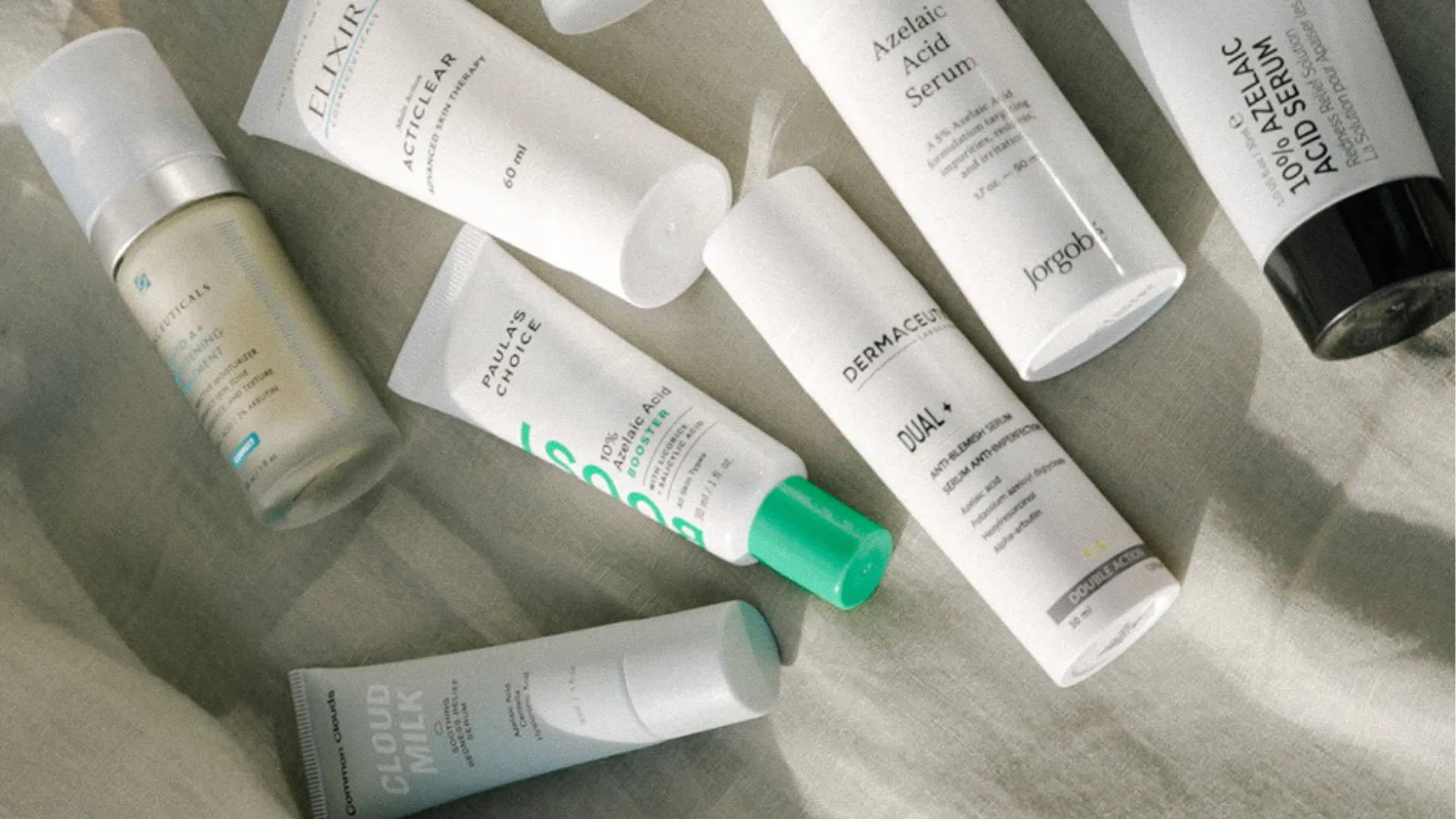 Test av azelainsyra från Common Clouds, Jorgobé, The Inkey List, Dermaceutic och SkinCeuticals. Rosa bakgrund.