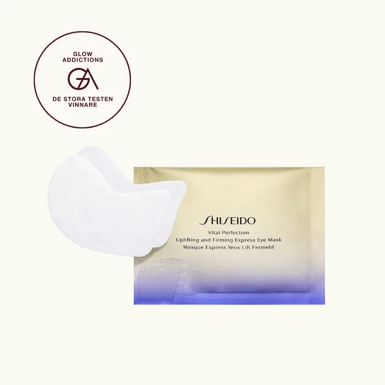 Bäst i test, eye patches: Shiseido Vital Perfection Uplifting & Firming Express Eye Mask, som fick hela 4.50 av 5.00 av Glowaddictions testpanel. Bilden föreställer produkten mot krämfärgad bakgrund, med en ettikett som visar att produkten blev testvinnare.