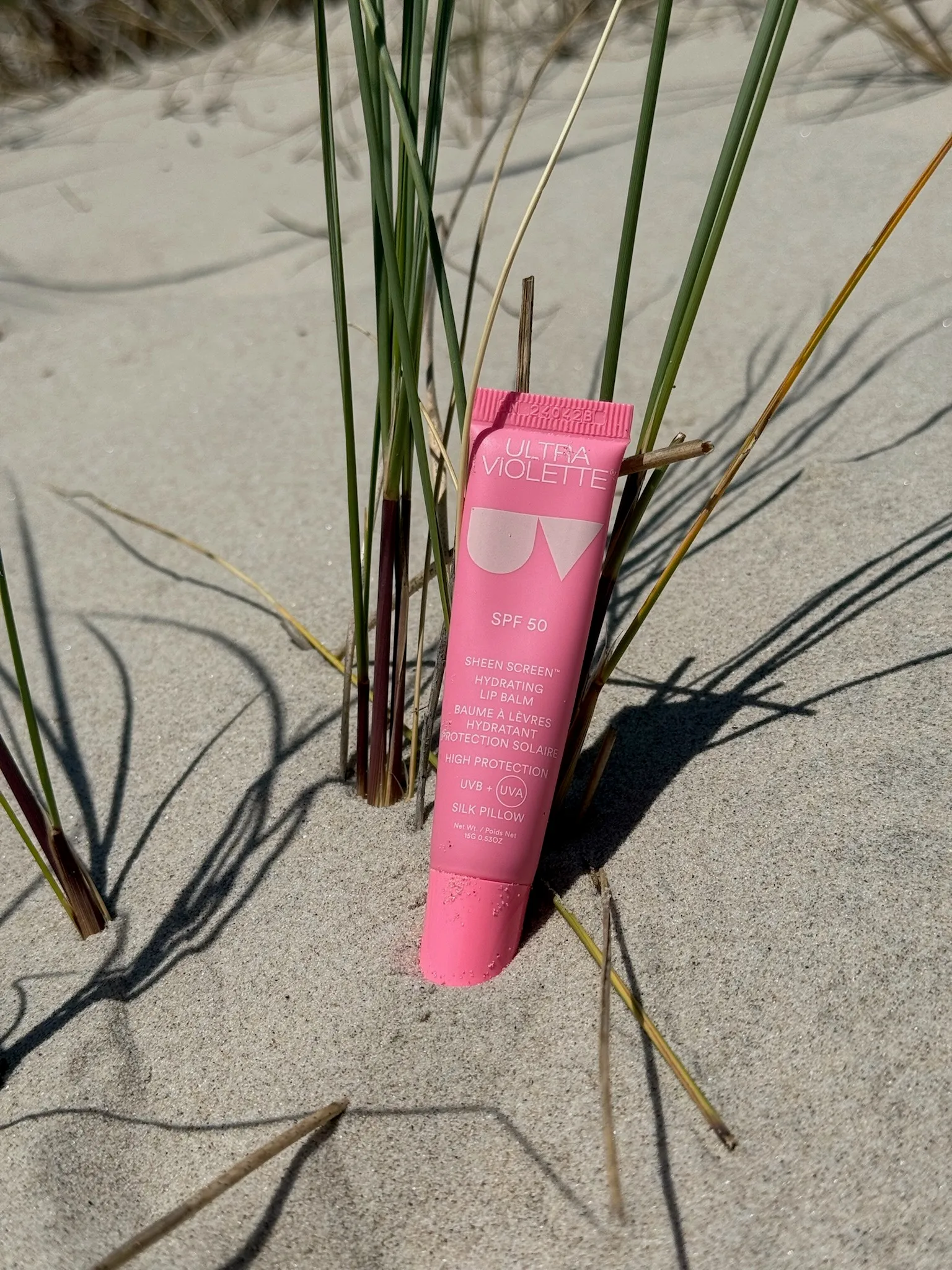 Ultra Violette Sheen Screen SPF 50, product image of Ultra Violette Sheen Screen SPF 50 at a beach