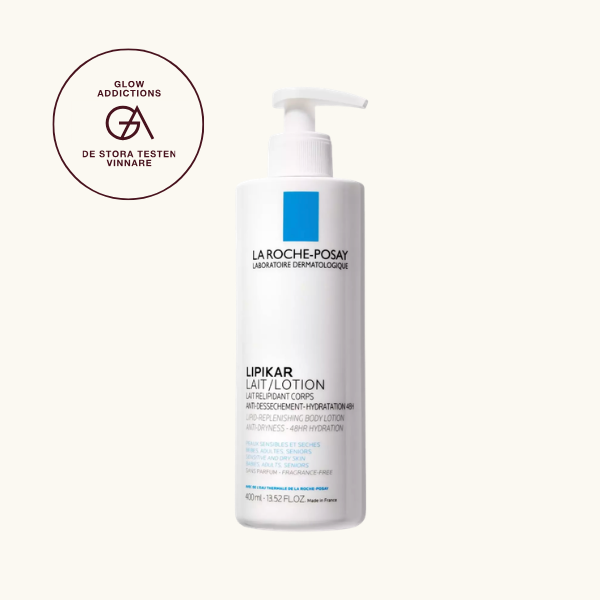 Bäst i test, Bodylotion: La Roche-Posay Lipikar Lait Lotion, som fick hela 4.55 av Glowaddictions testpanel och blev en av tre testvinnare. Bilden visar en vit plastflaska med pump, märkt med La Roche-Posay-logotypen och blå rektangel, samt texten "Lipikar Lait/Lotion". Flaskan rymmer 400 ml och är avsedd för känslig och torr hud hos både barn och vuxna.