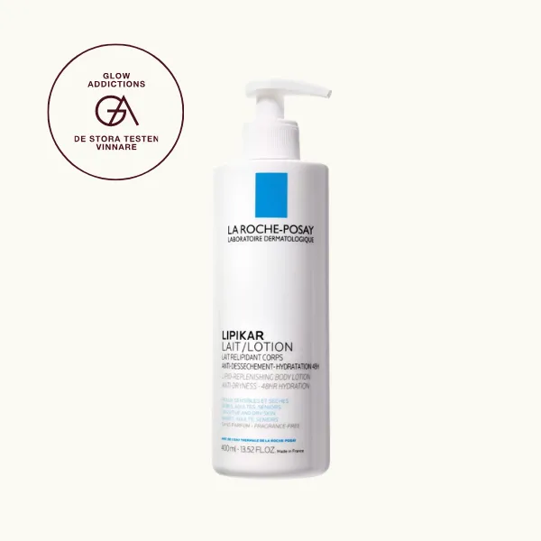 Bäst i test, Bodylotion: La Roche-Posay Lipikar Lait Lotion, som fick hela 4.55 av Glowaddictions testpanel och blev en av tre testvinnare. Bilden visar en vit plastflaska med pump, märkt med La Roche-Posay-logotypen och blå rektangel, samt texten "Lipikar Lait/Lotion". Flaskan rymmer 400 ml och är avsedd för känslig och torr hud hos både barn och vuxna.