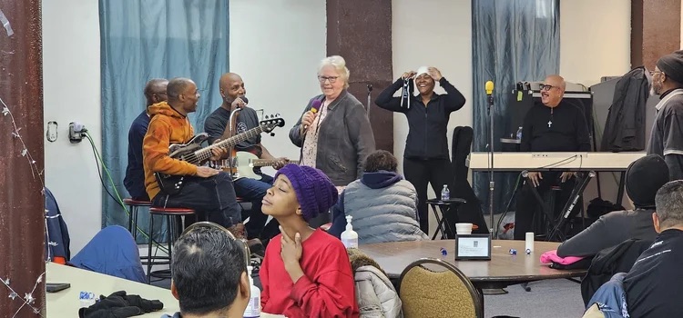 Woman speaking to group of listeners