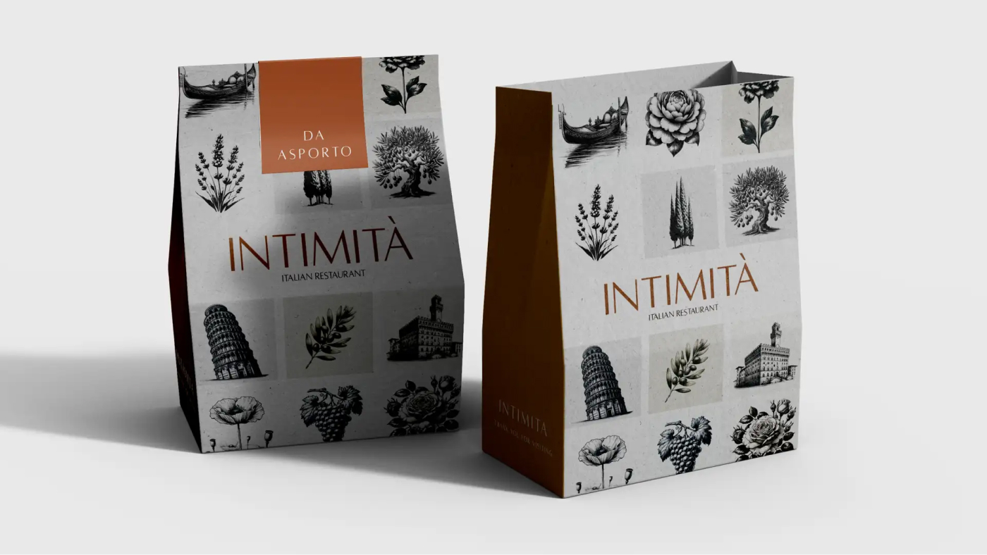 Intimità branded takeout bags with intricate illustrations and the restaurant name.