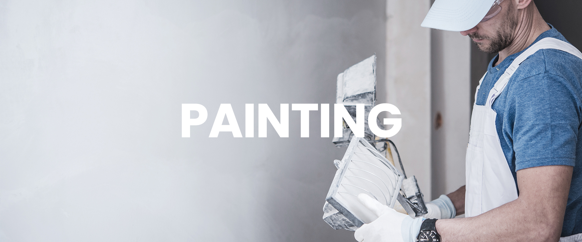 Painter setting up to paint a wall
