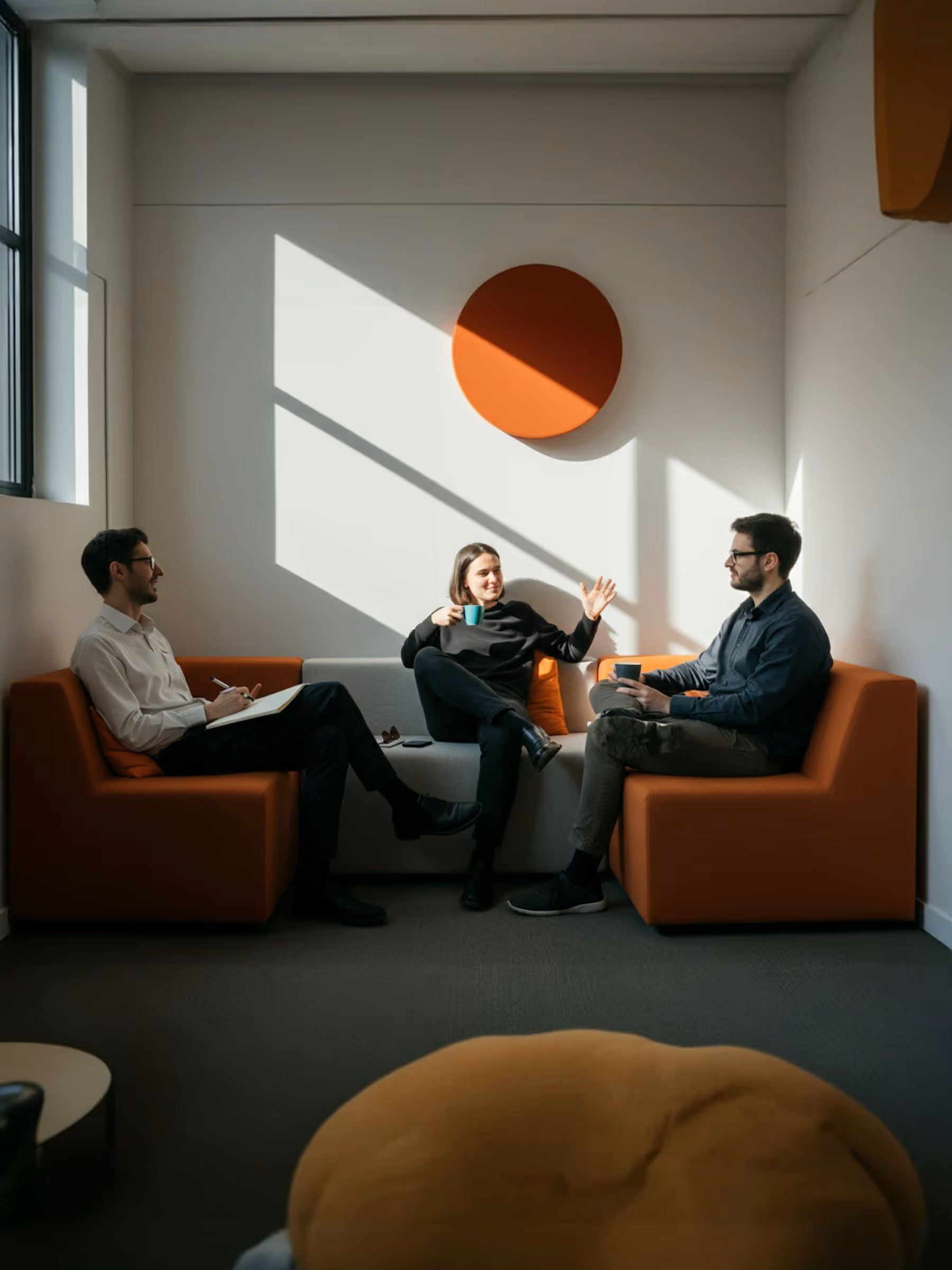 A couple of people sitting on a couch in a room.