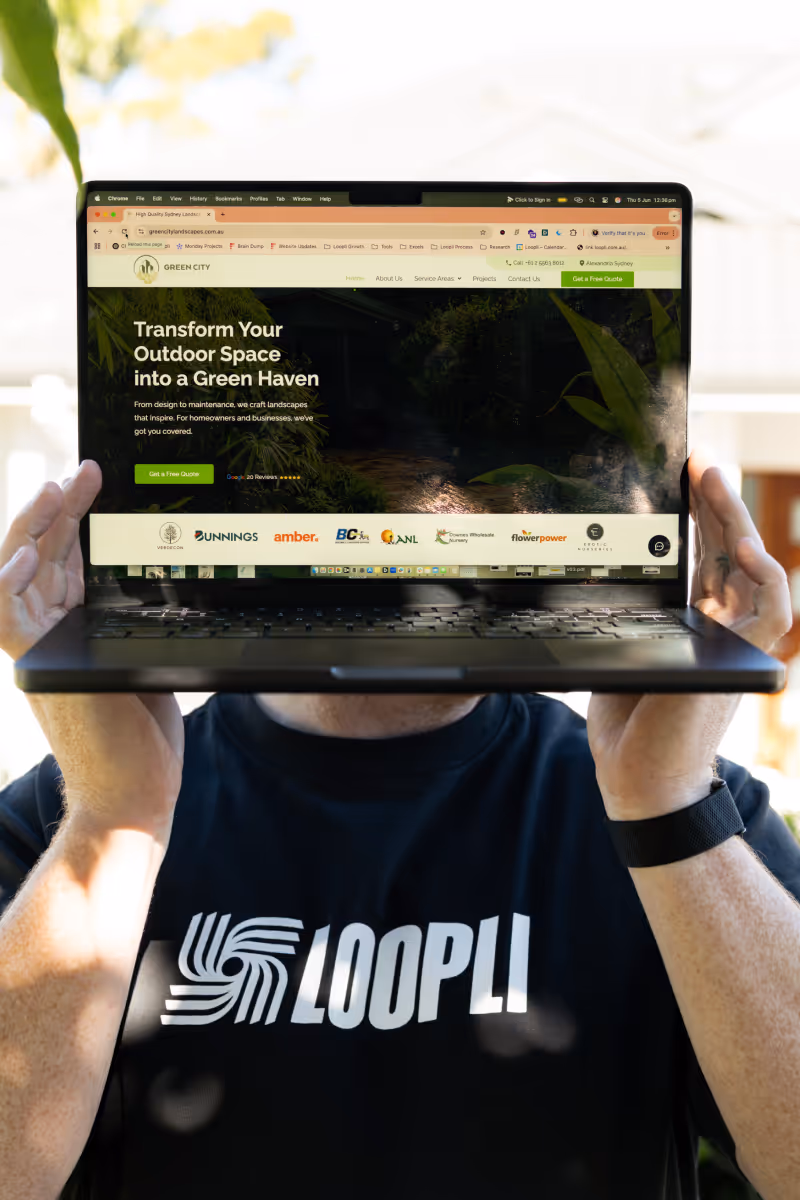 Jack holding up a laptop