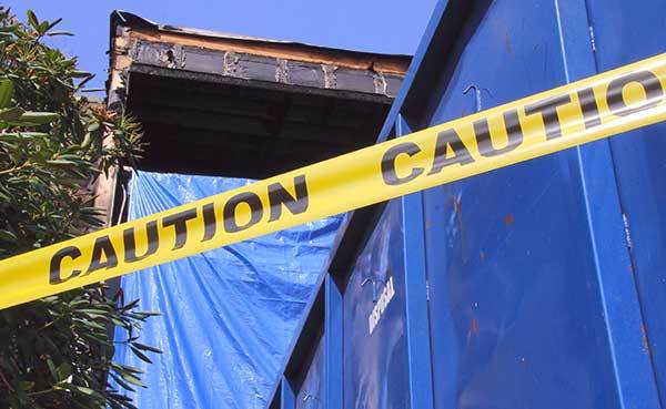 fore-damaged-house-fenced-off.jpg