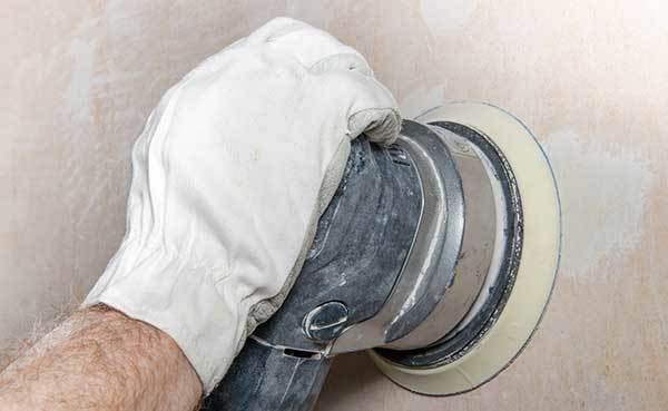 sanding-a-wall-with-a-power-sander.jpg