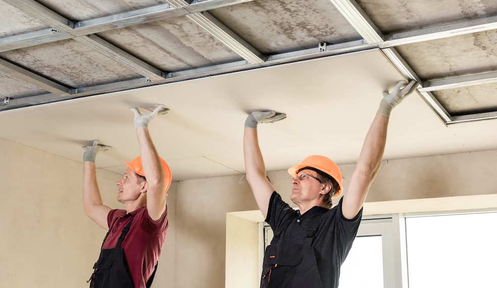 two men installing ceiling