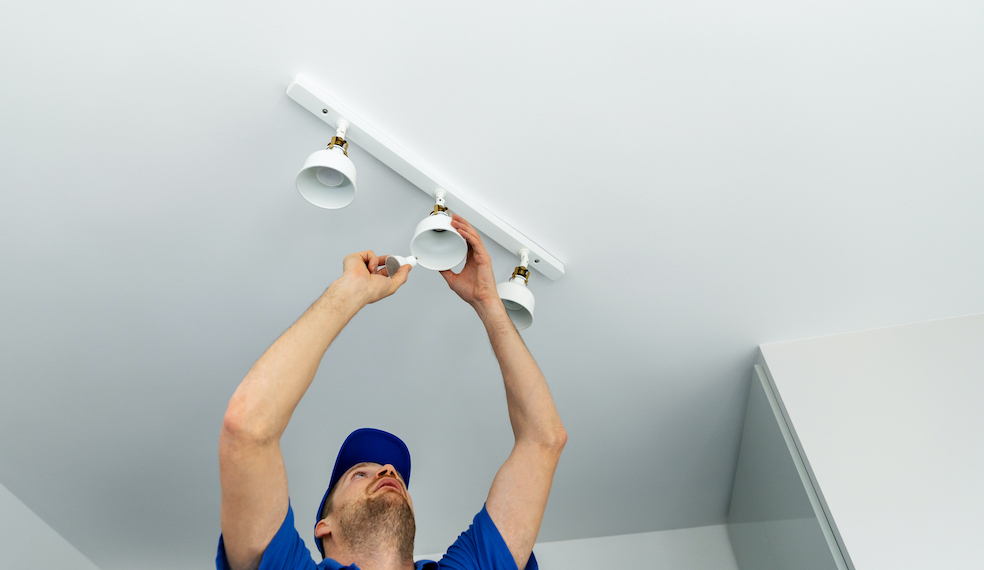 man installing lights