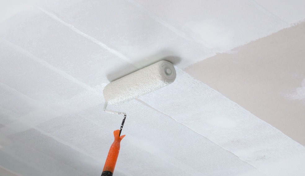 painting ceiling with a roller