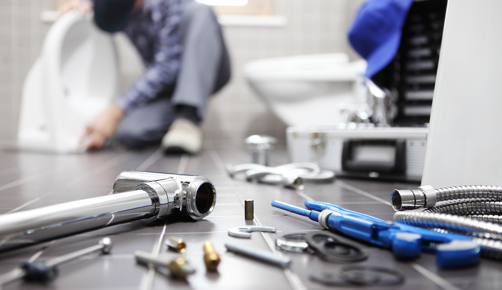 plumping tools on bathroom floor