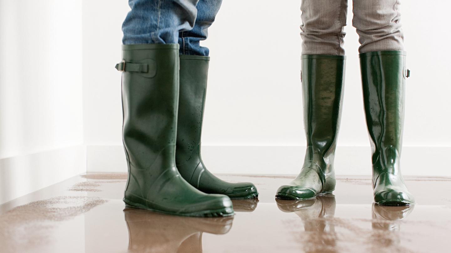 wearing gum boots on a flooded floor