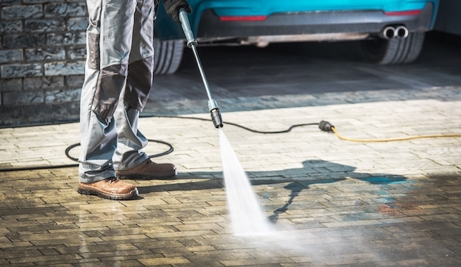 cleaning driveway with water blast