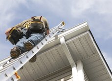 Maintenance professional inspecting a property with a clipboard