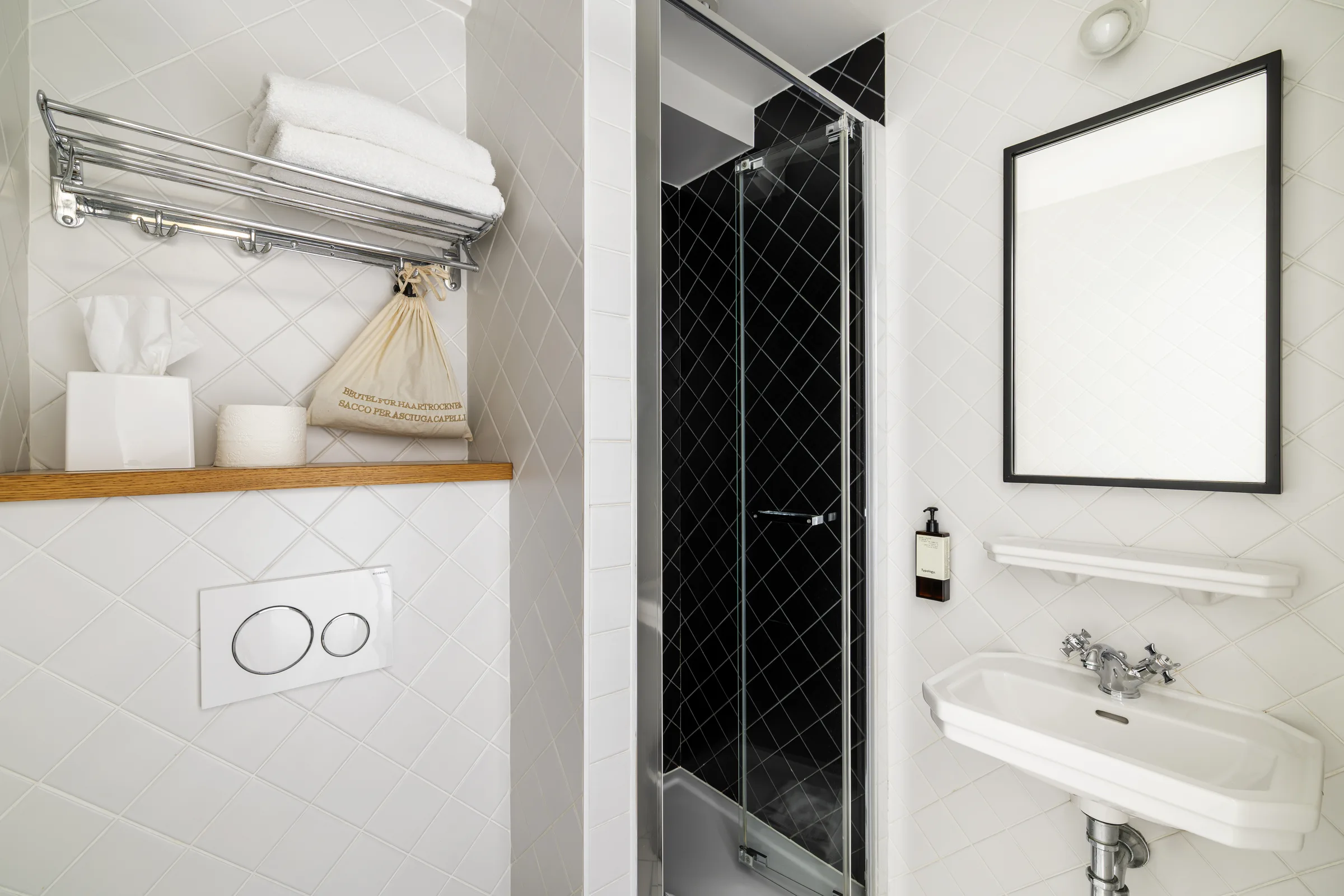 Comfort Room bathroom with black diamond tile shower