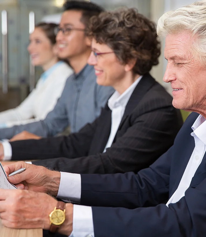 Merifund Capital client advisory panel evaluating portfolio strategies in formal boardroom