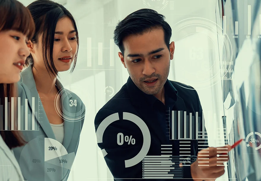 Strategic team reviewing financial data and analytics on a transparent digital interface.