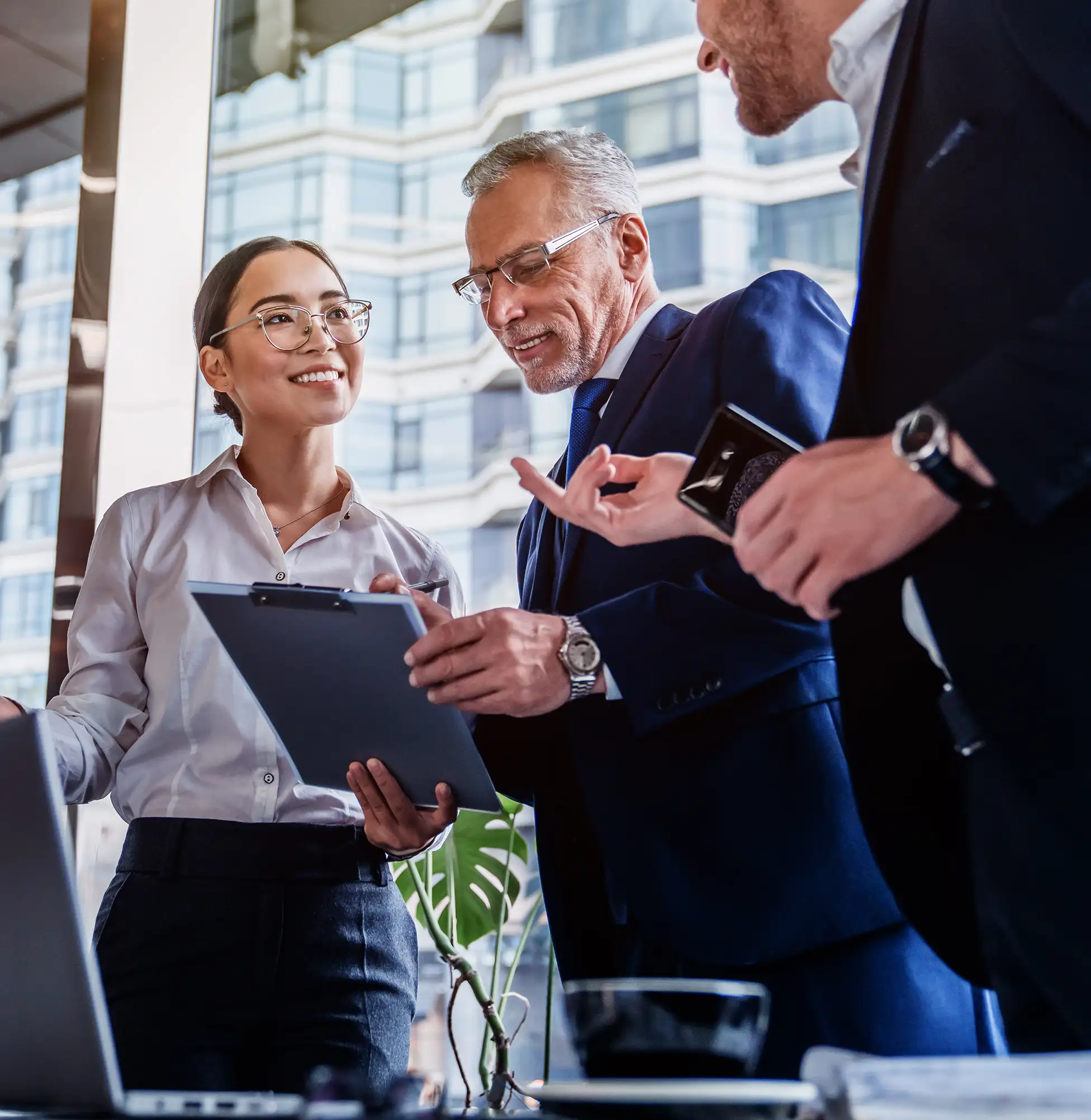 Experienced institutional investment specialists collaborating, illustrating Merifund Capital Management's commitment to long-term investment success and ESG best practices.