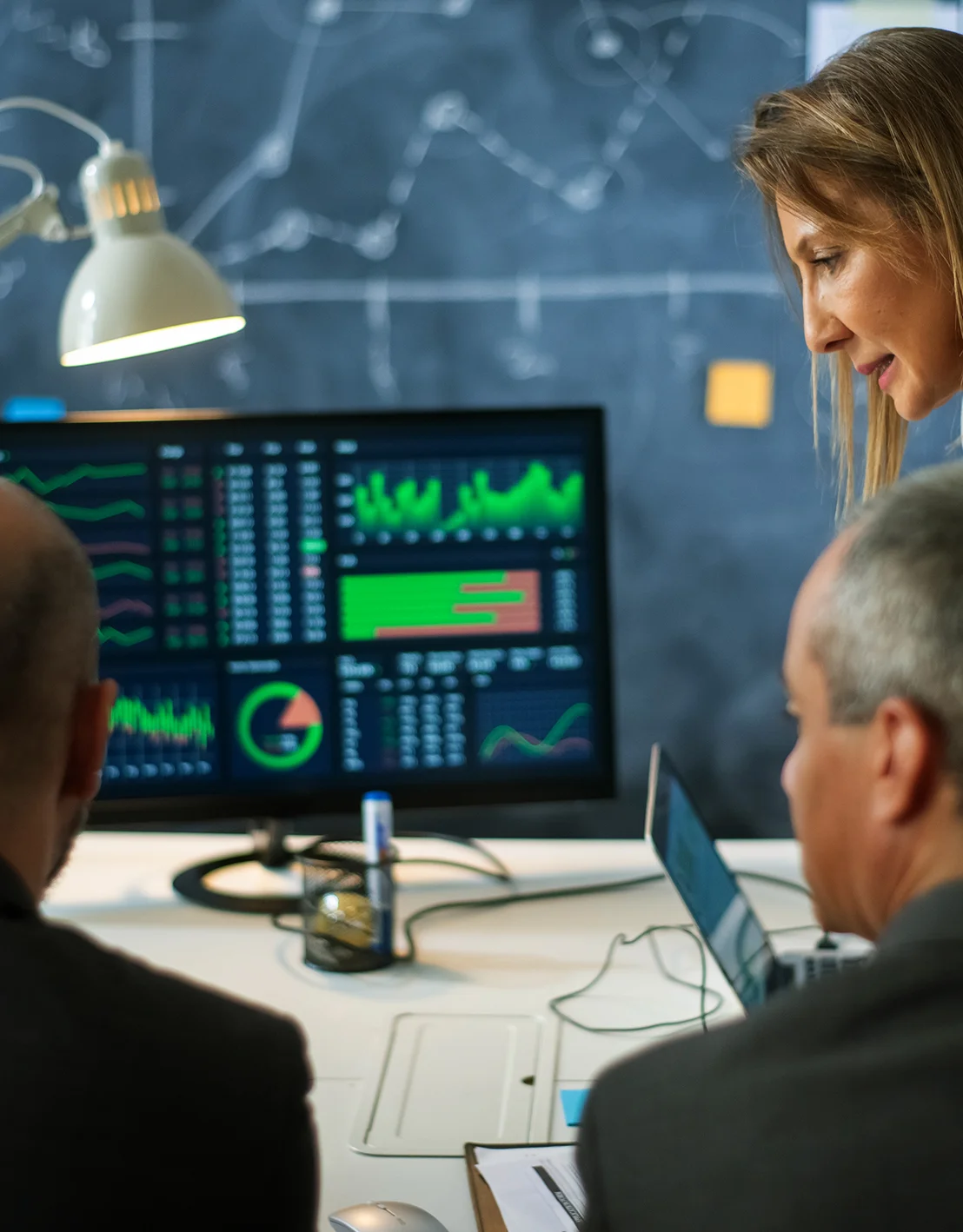 Investment specialists analysing market data and portfolio strategies, showcasing Merifund Capital Management’s insightful and personalised approach to portfolio management.