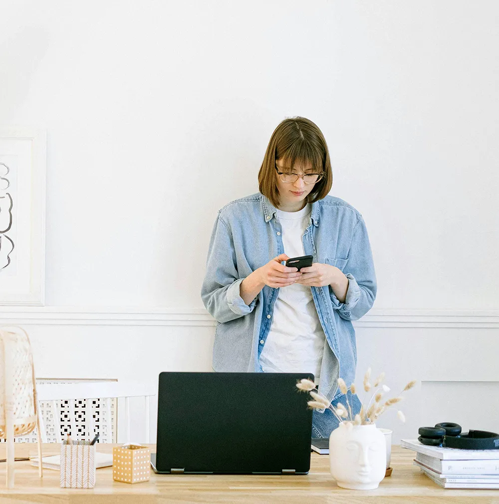 Woman checking emails on her phone.