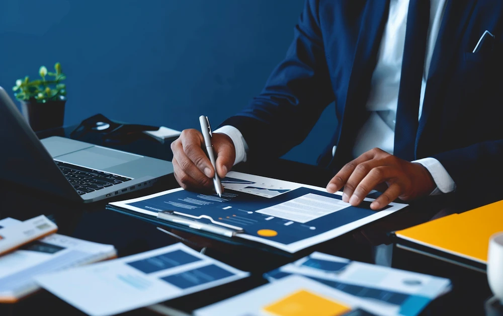 Business professional analyzing documents as part of the rebate management process, using financial data to optimize rebate programs and improve efficiency.