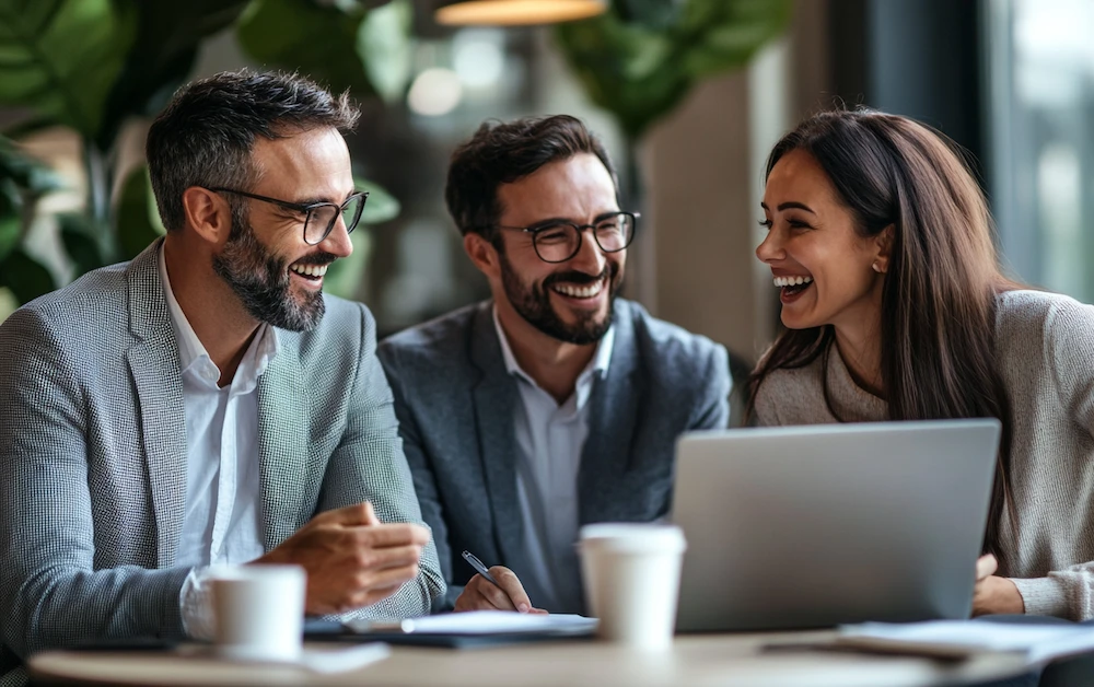 Finance professionals collaborating on account reconciliation using automated software, ensuring accuracy and efficiency in financial reporting.