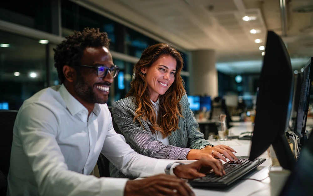 Accountants reviewing financial data on computer screens while applying balance sheet account reconciliation best practices to ensure accuracy and compliance.