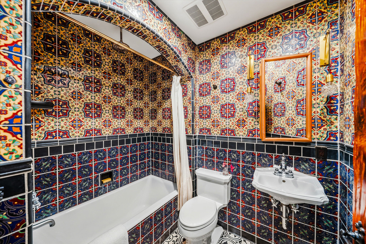 The studio is emblazoned with vibrant tiles.