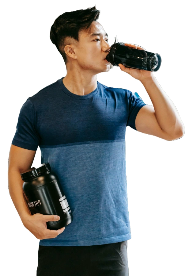 a man drinking a protein shake.