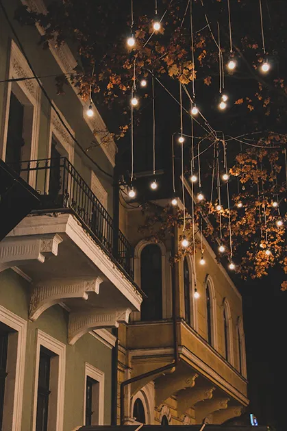 Hotel entrance beautifully decorated with Christmas lights, garlands, and festive ornaments during the holiday season.